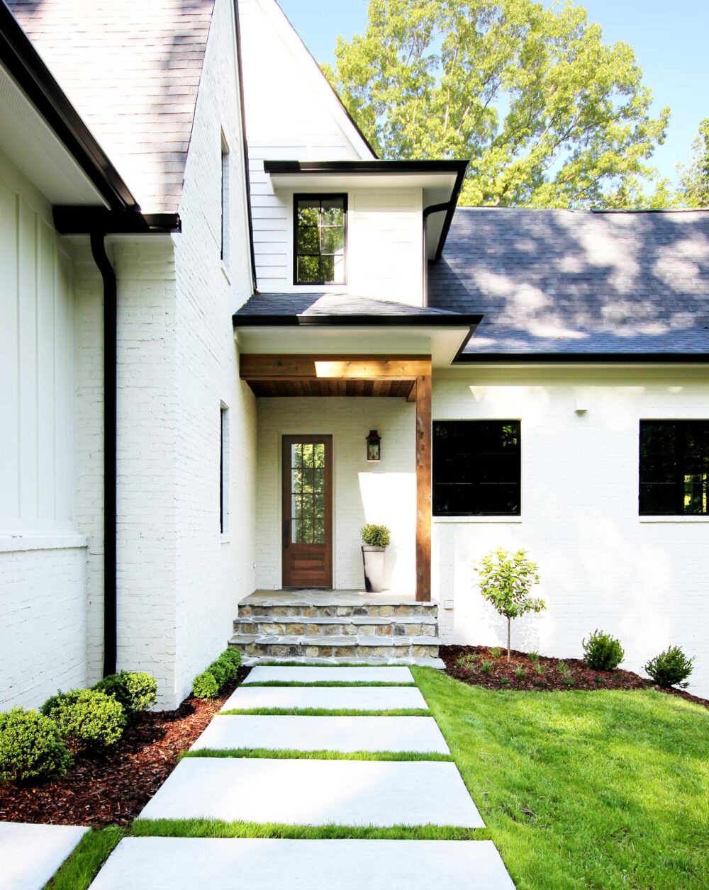 White House with Black Trim: Classic or Trendy? - Plank and Pillow